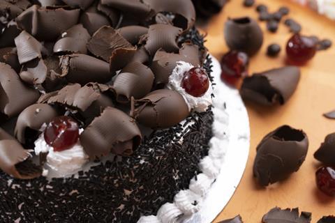 Black forest cake with cherries and cream