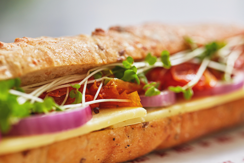 Close up of the Pret Posh Cheddar Baguette with cress, tomato and more