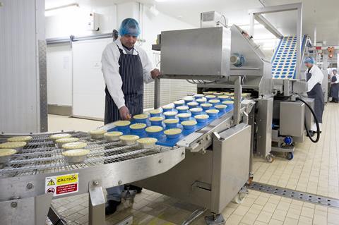 Pies being produced on a factory line