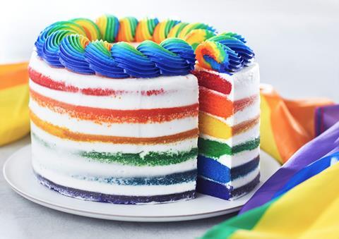 A rainbow cake with multi-coloured frosting