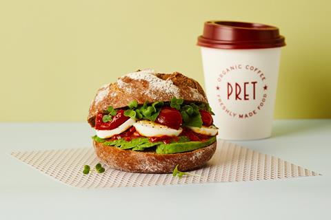 Pret's new Avo Brunch Rye Roll next to a takeaway cup of coffee