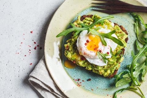 Avocado and a runny poached egg on a slice of toast