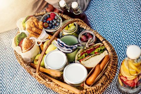 A selection of tasty food in a picnic basket