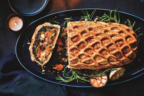 A Brie, Butternut and Mushroom Wellington with stalks of rosemary around the side