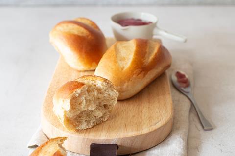 Brioche buns on a wooden board made with GoodMills Innovation Snow Prebiotic Fibres