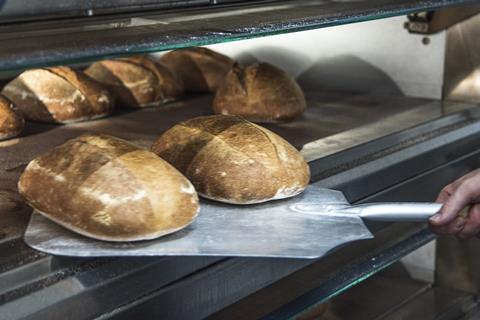 Sourdough loaves coming out of oven