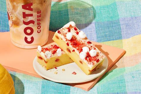 Costa Coffee's new Eton Mess Blondie next to a plastic cup of milk coffee