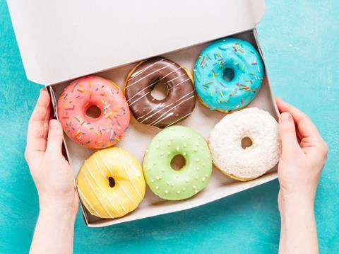 Coloured and glazed doughnuts in a box