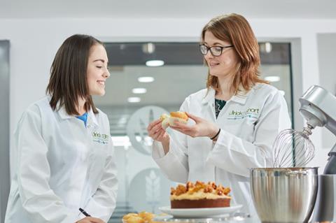 Two developers at Ulrick & Short looking at cakes