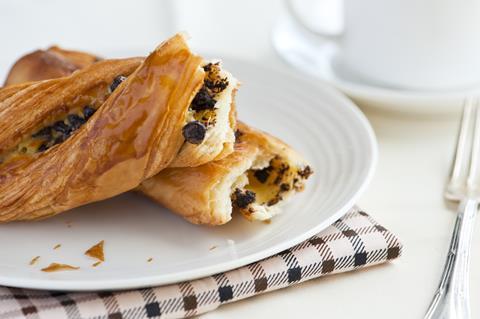 A chocolate twist pastry on a white plate