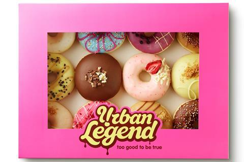 A pink Urban Legend box with brightly coloured doughnuts inside
