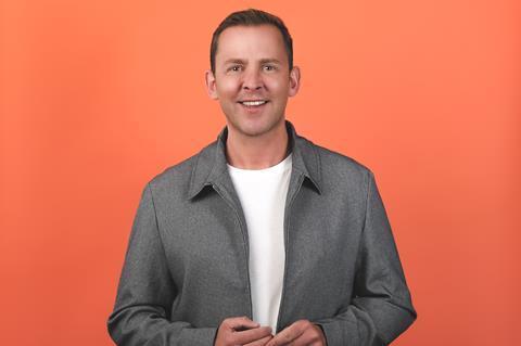 Scott Mills against an orange background