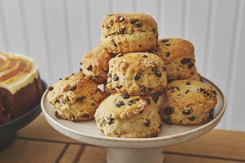 A pile of fruit scones on a cake stand