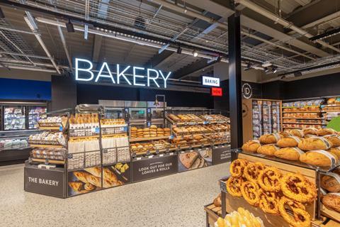 Inside an M&S Bakery with shelves laden with loaves and more