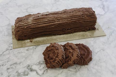 A chocolate yule log with slices in front