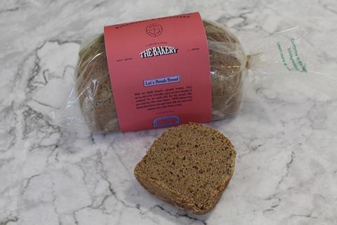 A loaf in red packaging with a slice in front