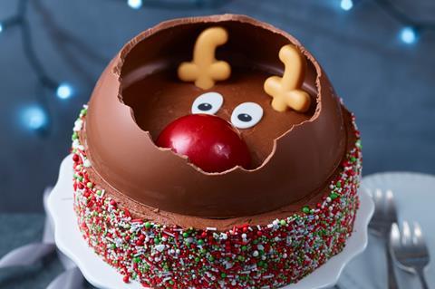 Chocolate cake with Christmas sprinkles and a reindeer face on top