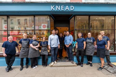 Knead Bakery - Co-founders John Hawes and Kris Biggs (centre in shirts) join staff members outside the new Oxford bakery shop - 2100x1400
