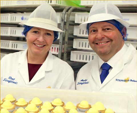 André Sarafilovic and his wife Rona in white jackets and hats in a bakery