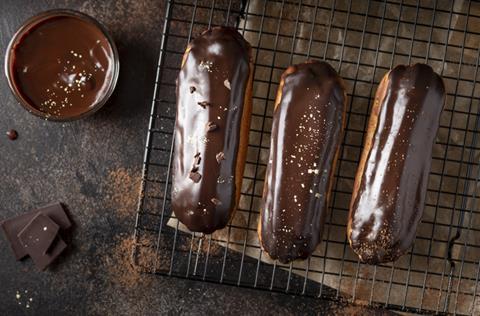 Chocolate eclairs on rack