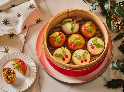 Bao buns that look like Christmas puddings in a steaming basket