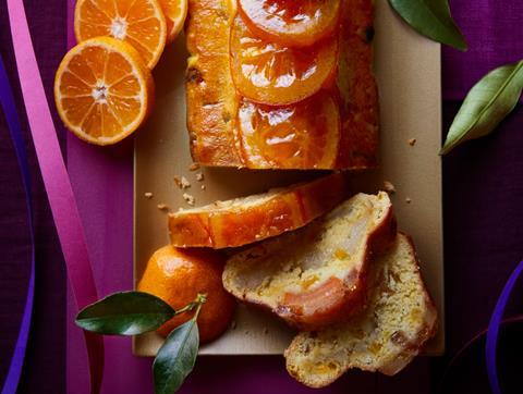 Sliced stollen with shiny orange slices on top