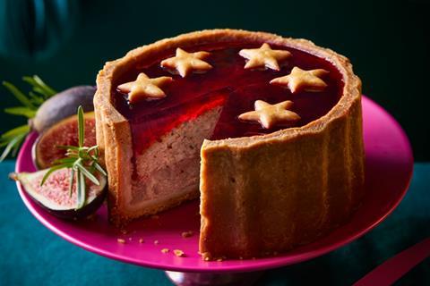 Pork pie with red jelly on top and pastry stars