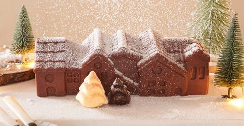 A chocolate village scene with fake snow