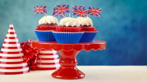 Cupcakes with white frosting and Union Jack flags