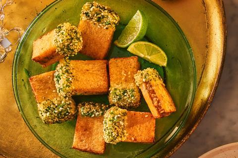 Posh prawn toasties on a green plate with lime wedges