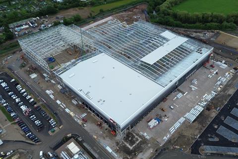 A bird's eye view of a manufacturing building under construction