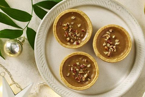 Three sticky toffee tarts on a white plate