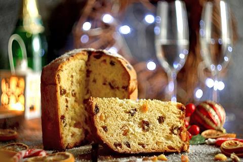 A festive panettone with a slice taken out