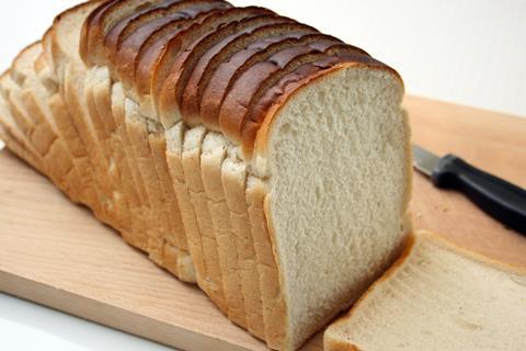 White sliced bread on a cutting board