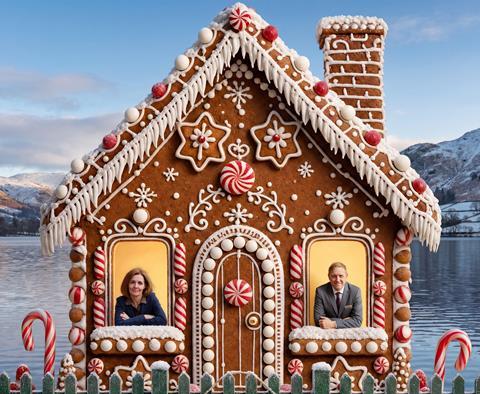 Studio Thameswater - Joanne Hunter and Low Wood Bay Resort & Spa GM Mark Needham in the windows of a gingerbread house