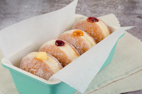 Four jam doughnuts with different flavours of jam inside