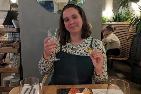 Amy North with a glass of wine at bread restaurant