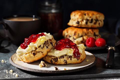 Chocolate Chip & Caramel Scones loaded with clotted cream and strawberry jam