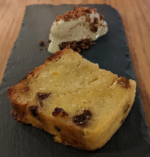 A bread and butter pudding with brown bread ice cream