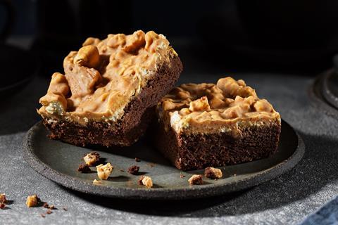 Popcorn Loaded Brownies on a black plate