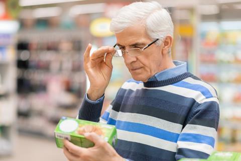 Shopper reading a food label