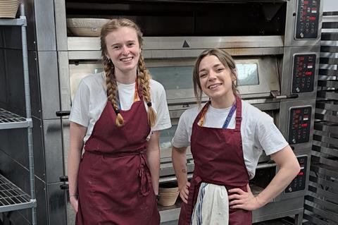 Ella Muddiman and Naomi Spaven in a professional bakery