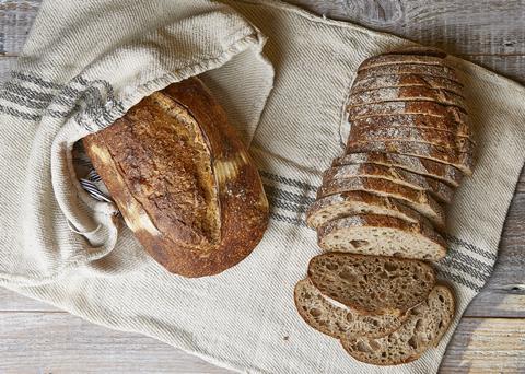 A whole sourdough and sliced sourdough from Good In Bread