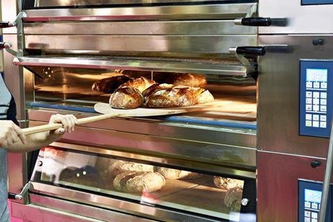 Bread being taken out of deck oven