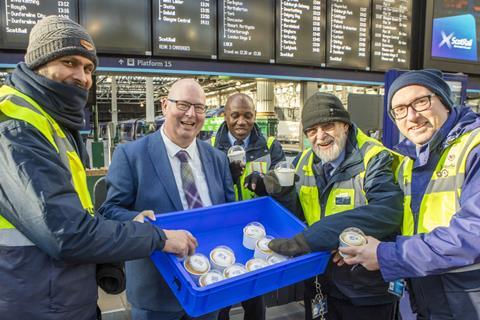 Scottish Bakers training and development manager Scott Anderson, gives away cupcakes at Waverley Station in Edinburgh as part of the 2024 Scottish Baker of the Year launch - Scottish Bakers - 2100 x 1400