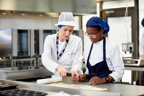 A trainee and an instructor in a bakery lesson at Moulton College